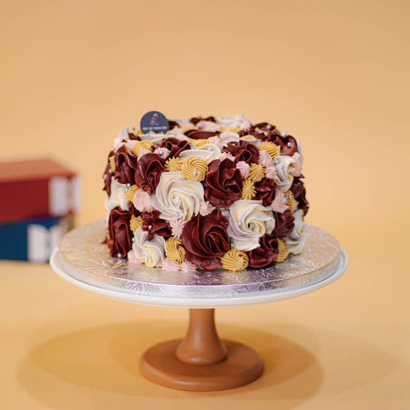 Hand-Piped Burgundy and Marble Floral Cake